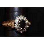 9ct gold ring set with central black stone size T