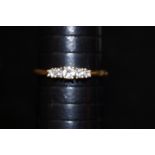 18 ct gold and 5 stone diamond ring approximately