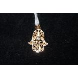 9ct gold pendant with central white stone