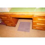 Oak twin pedestal desk, with leather top.
