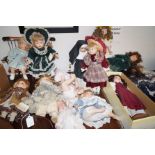 A large collection of porcelain faced dolls