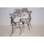 Pair of polished aluminium, reindeer candle holder