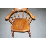 19th century elm and beech Captains chair with bow rail, turned spindle supports and stretchers, elm