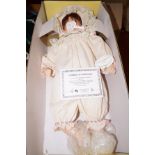 Boxed porcelain doll with COA
