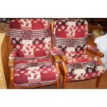 Two wooden framed arm chairs