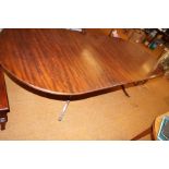 Extending mahogany dining table