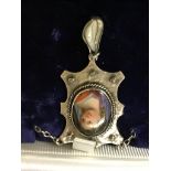 A silver pendant set with seed pearls and a portrait miniature by James Fenton