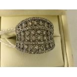 A 9ct wide diamond set filigree dress ring