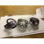 Three silver dress rings