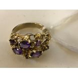 A 9ct amethyst set abstract ring