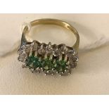 A 9ct green and white stone dress ring