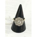 WITHDRAWN An 18ct diamond daisy ring
