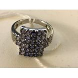 A 10k multi-stone set dress ring