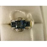 An 18ct blue stone and diamond dress ring