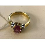 An 18k pink tourmaline and diamond dress ring