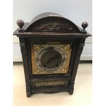 An oak cased German mantle clock