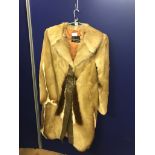 A full-length ladies impala skin coat