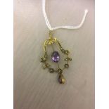 An Edwardian 9ct amethyst and seed pearl pendant