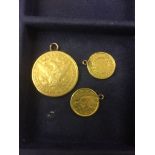 An 1884 Carson City gold 5 dollar coin and two 1852 gold one dollar coins,