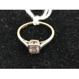 An 18ct gold diamond solitaire ring approx half ct