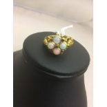 A 9ct opal and ruby dress ring