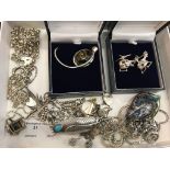 A quantity of silver jewellery: chains, ring, pendants, green,