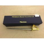 A boxed miniature Royal Naval sword