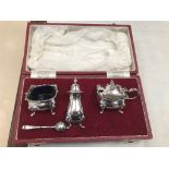 A boxed HM silver cruet set: maker's mark 'R & B'