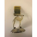 A HM siilver desk calendar in the form of a camel