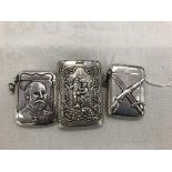 Three silver vesta cases