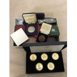 Boxed vintage medallions and coin sets