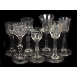 Seven 18th Century Folded Rim Wine Glasses: Five with engraved bowls,
