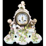 A Meissen Style Mantel Clock: The ceramic case in Meissen style adorned with cherubs and floral