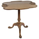 A Mid-20th Century Chippendale Style Tilt-Top Table: With double serpentine top carved with two