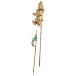 Two 9ct Stick Pins: To include an articulated clown and an emerald and opal example