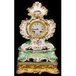 A Henry Marc French Ceramic Mantel Clock: The ornate gilt and floral design clock with green ground,