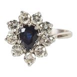 A Pendaluque Cut Sapphire Ring with Diamond Surround CONDITION REPORT: Colour of