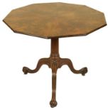 An 18th Century Mahogany Decagonal Tilt-Top Table: Above three cabriole shaped legs and scroll