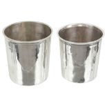 Two 19th Century French Silver Beakers: Of conventional form with slight flared rim, one initialled,