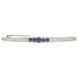 An Art Deco Sapphire and Diamond Bar Brooch: Comprising eighteen graduated fine white brilliant cut