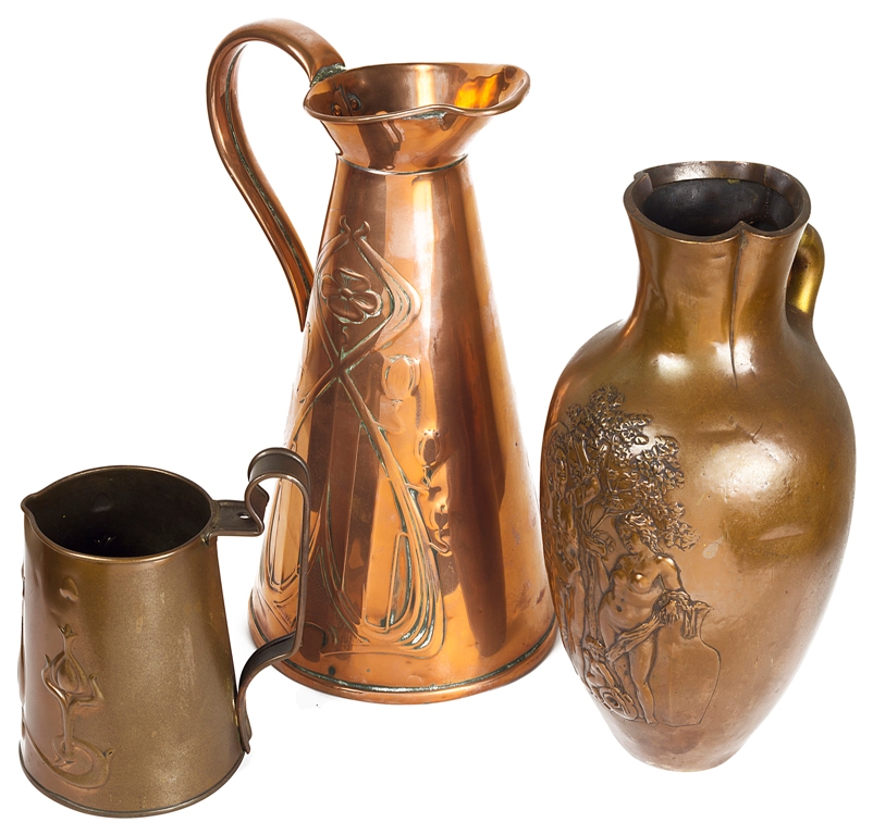 Three Copper Items: To include a copper ewer/pitcher, embossed with scrolling foliage,