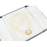 An 18ct Three Strand String of Pearls: With detachable diamond and blister pearl clasp for either