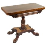 A William IV Rosewood Tea Table: On quadruple turned stem on lion paw feet,