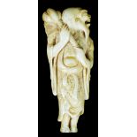 A 19th century ivory netsuke: Depicting a man holding a swish, L 7.