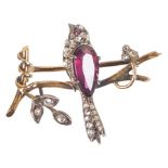 A 19th Century French Gold Brooch in the Form of a Bird: Beautifully stylized with garnet body,