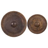 Two Oriental gongs with incised dragon decoration,