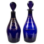 Two Georgian Bristol Blue Glass Decanters: The centre bodies with "Rum" and "Brandy" in applied