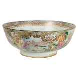 A large Chinese Qianlong (1711-1799) period famille rose punch bowl: The sides decorated with