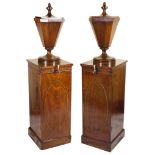 A Pair of Wine Cisterns: George III, mahogany, each cistern in the form of a fluted urn vase,