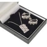 An Art Deco Style Pendant and Earring Set: Comprising baguette and brilliant cut diamonds set in